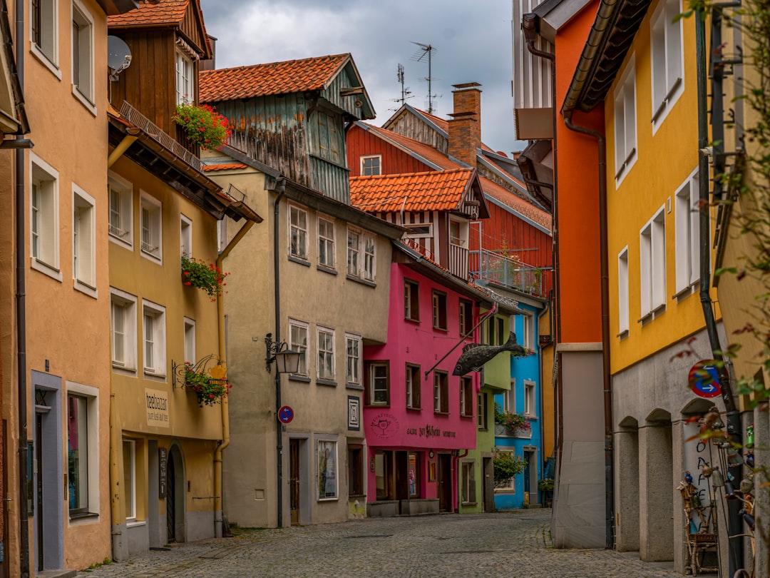 A narrow street with colorful buildings on both sides
